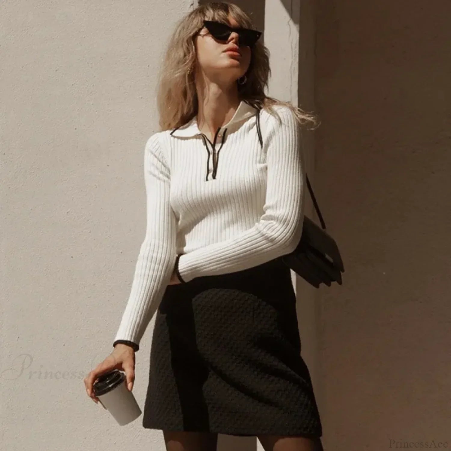 Long sleeve patchwork colorblock sweater displayed from the front.