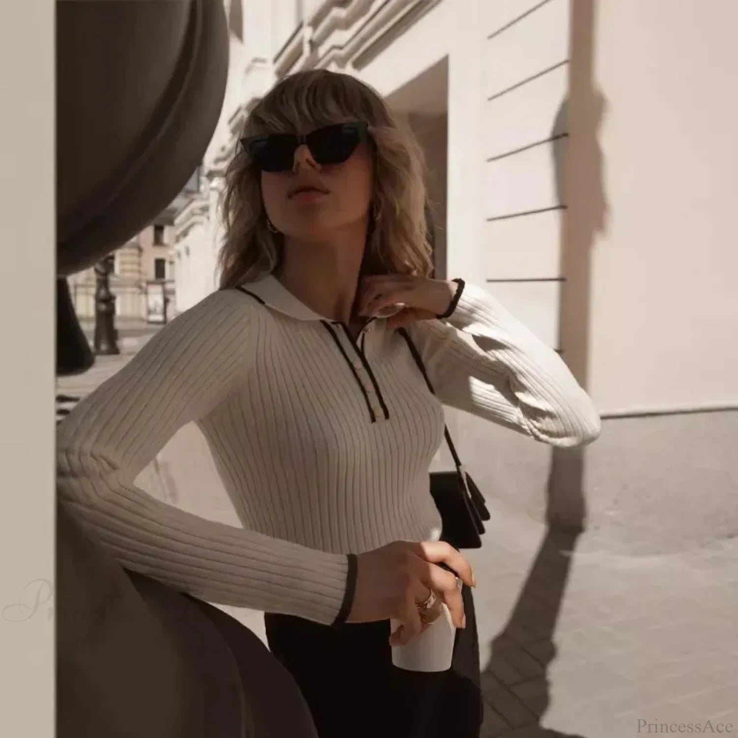 Side view of the long sleeve patchwork colorblock sweater.
