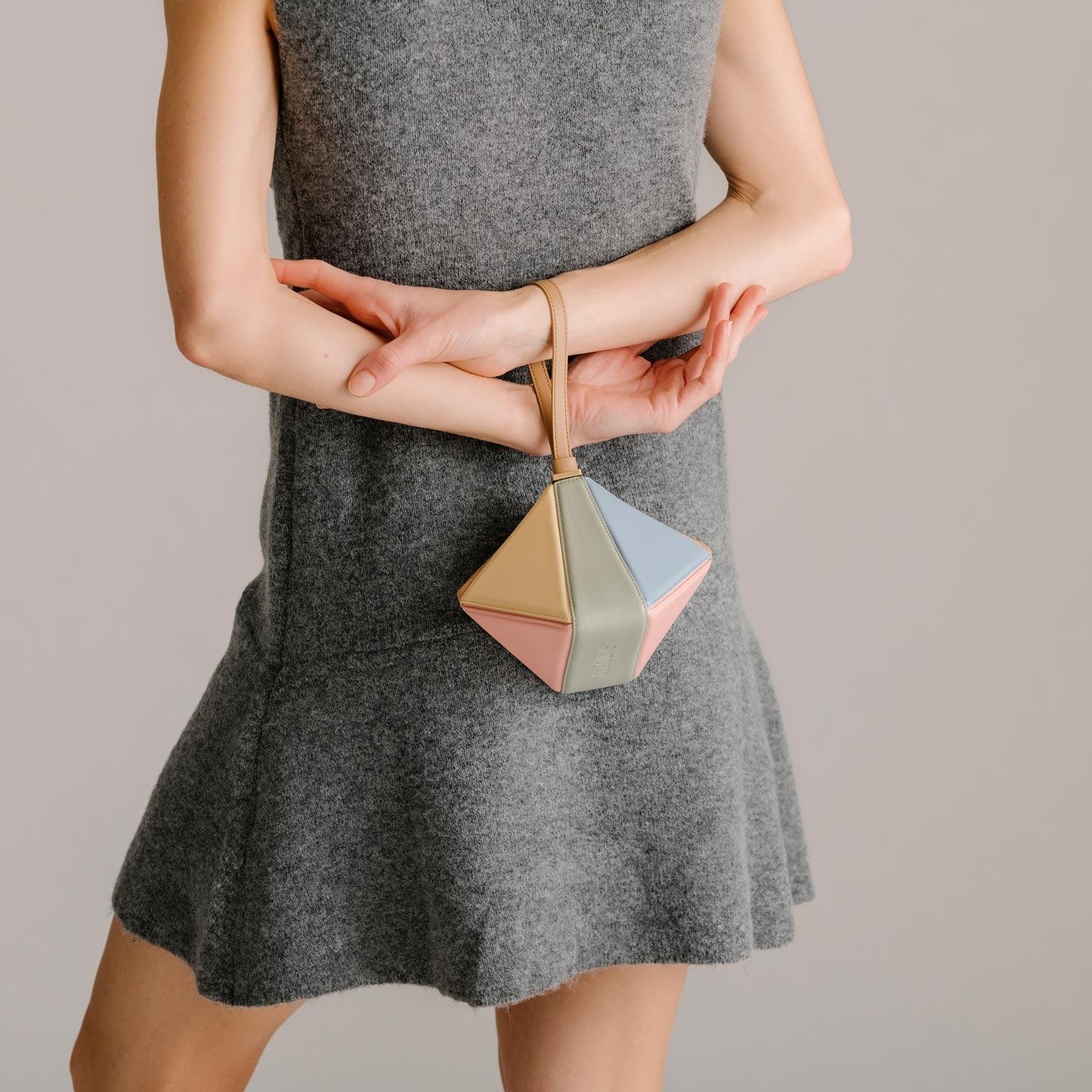 Side view of the calf leather mini bag showing its slim profile