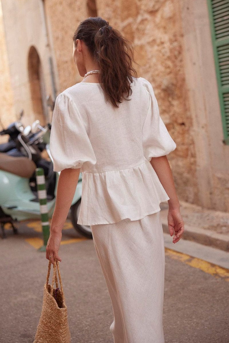 Side view of the white shirt and skirt coordinated outfit
