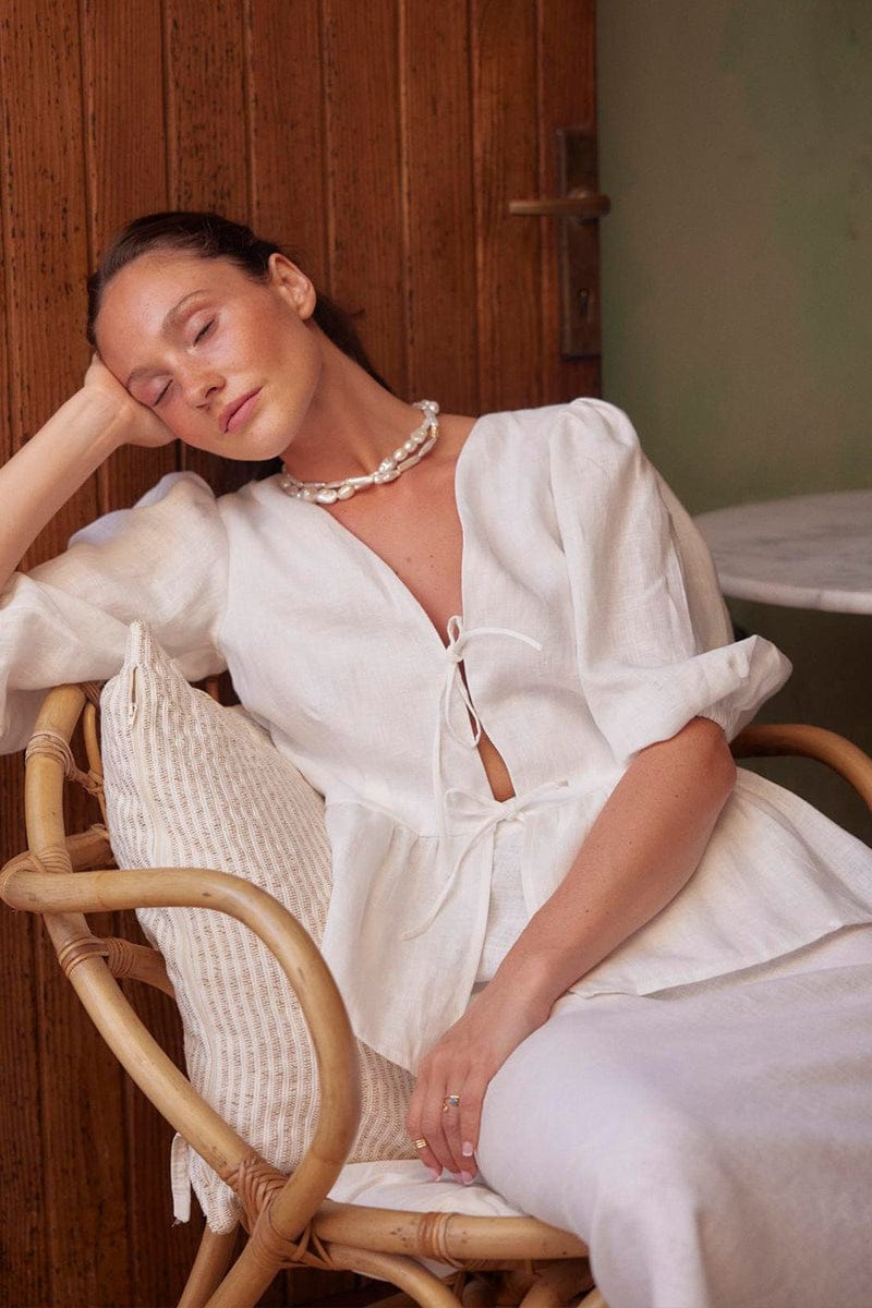 White cotton shirt and skirt set styled as a complete outfit
