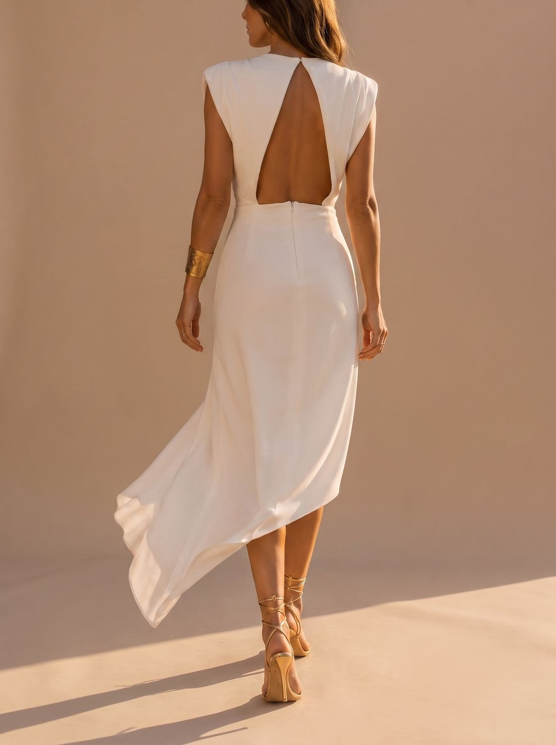 Side view of the women's sleeveless midi dress silhouette