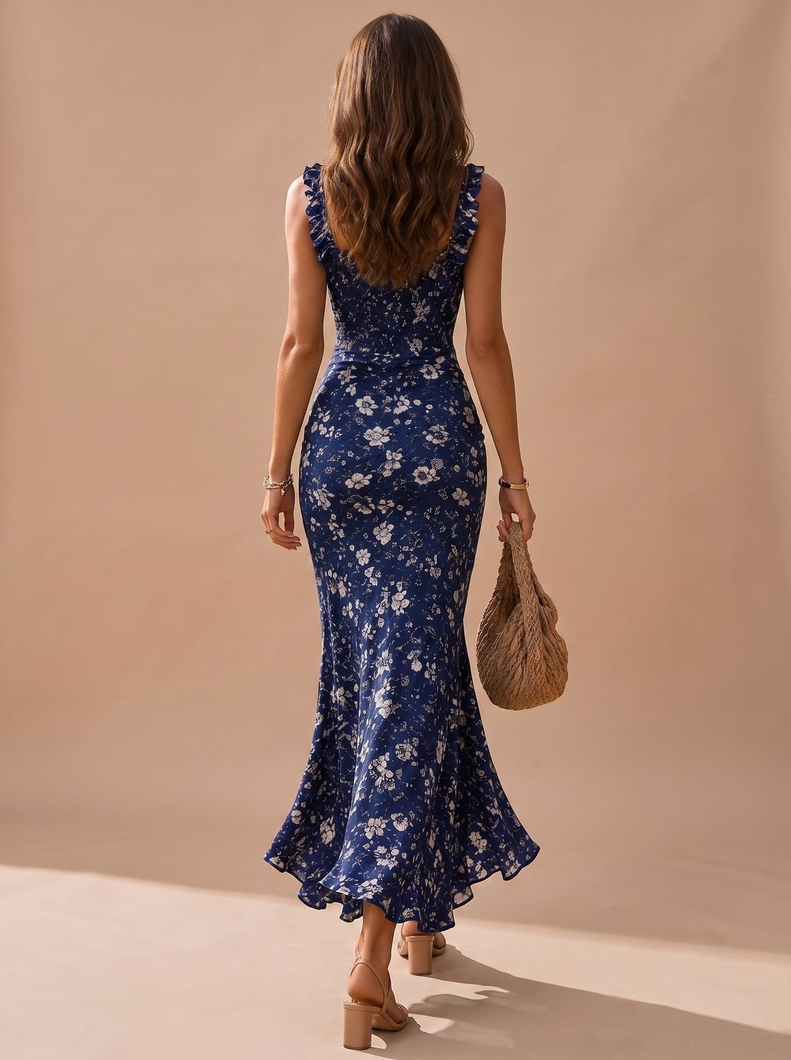 Front view of a women's floral midi dress with a smocked bodice