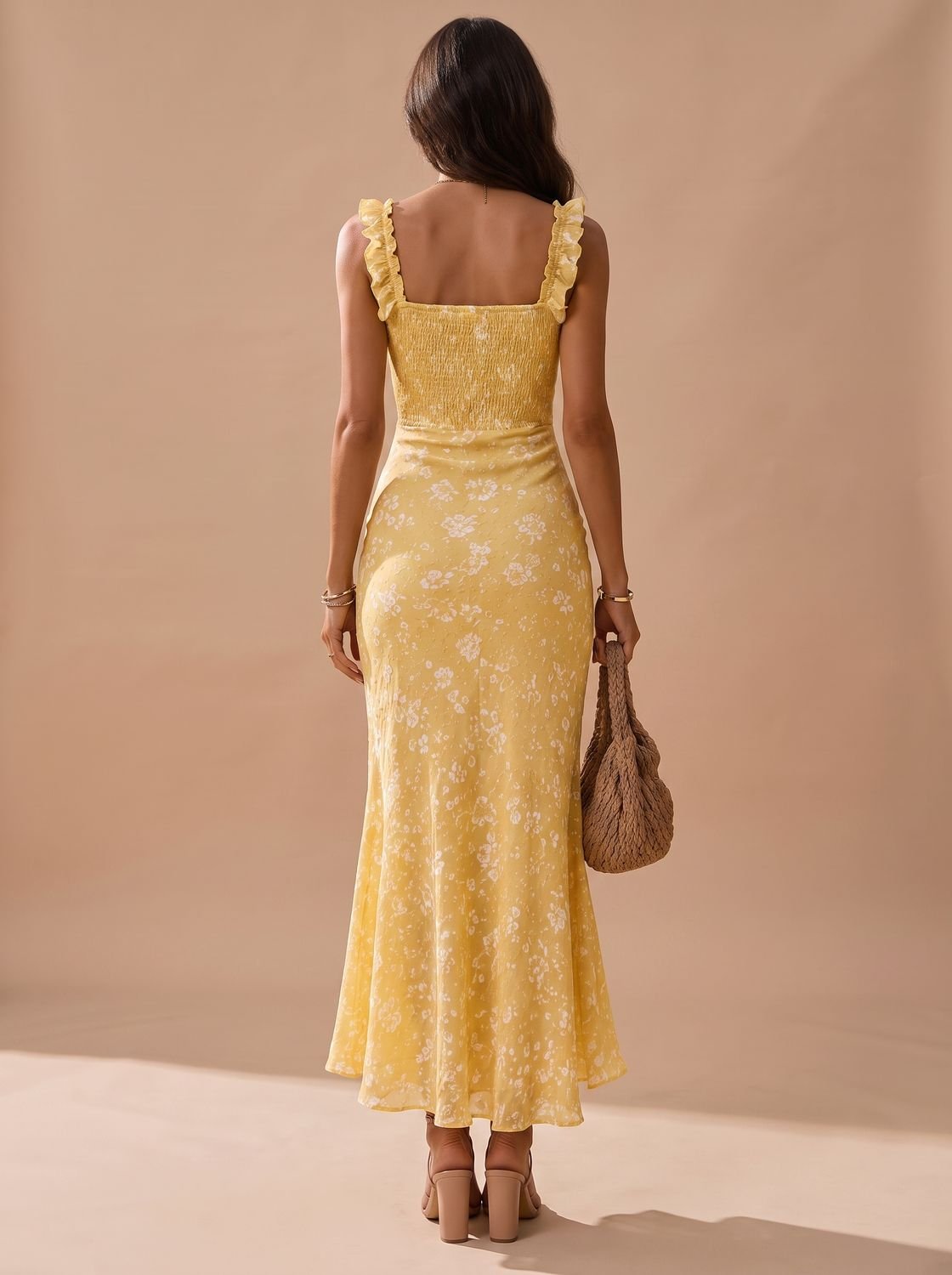 Full-length view of the floral midi dress with a flowing skirt
