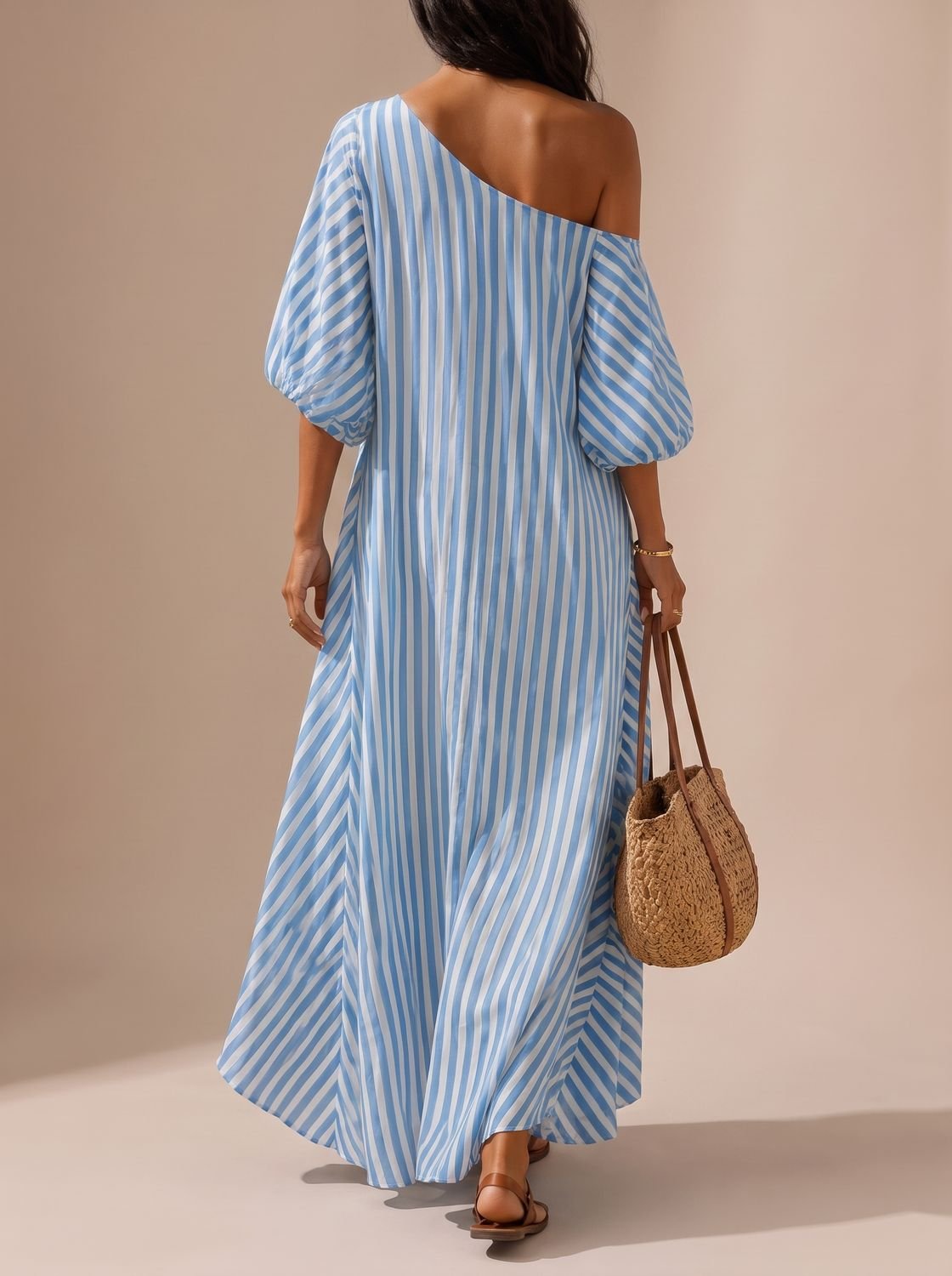 Flowy women's striped maxi dress with a one-shoulder neckline