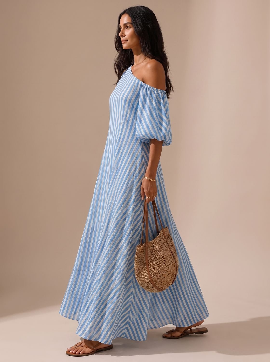 Side view of a women's one-shoulder striped maxi dress