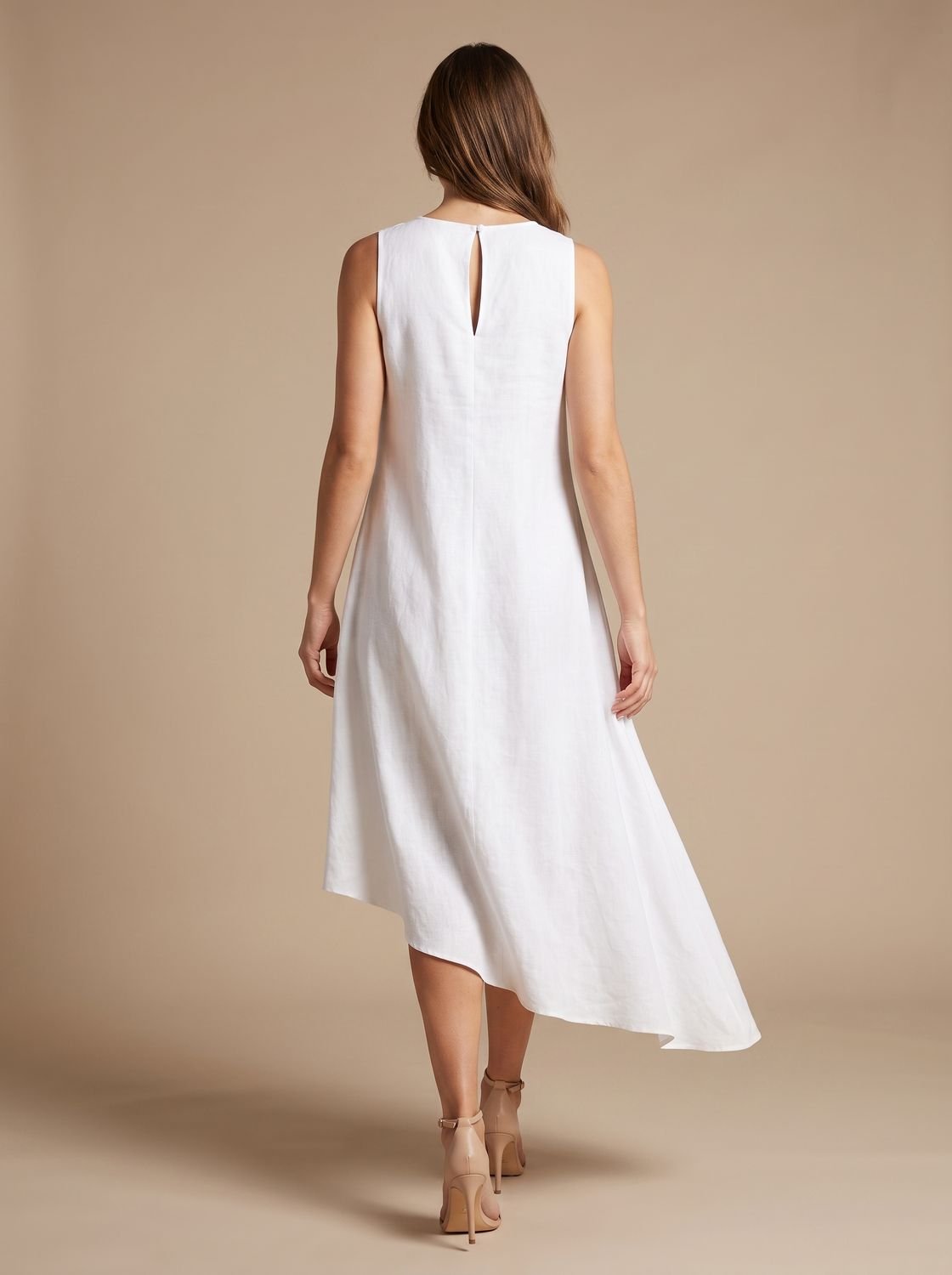 Side view showing the flowy asymmetric hem of the midi dress