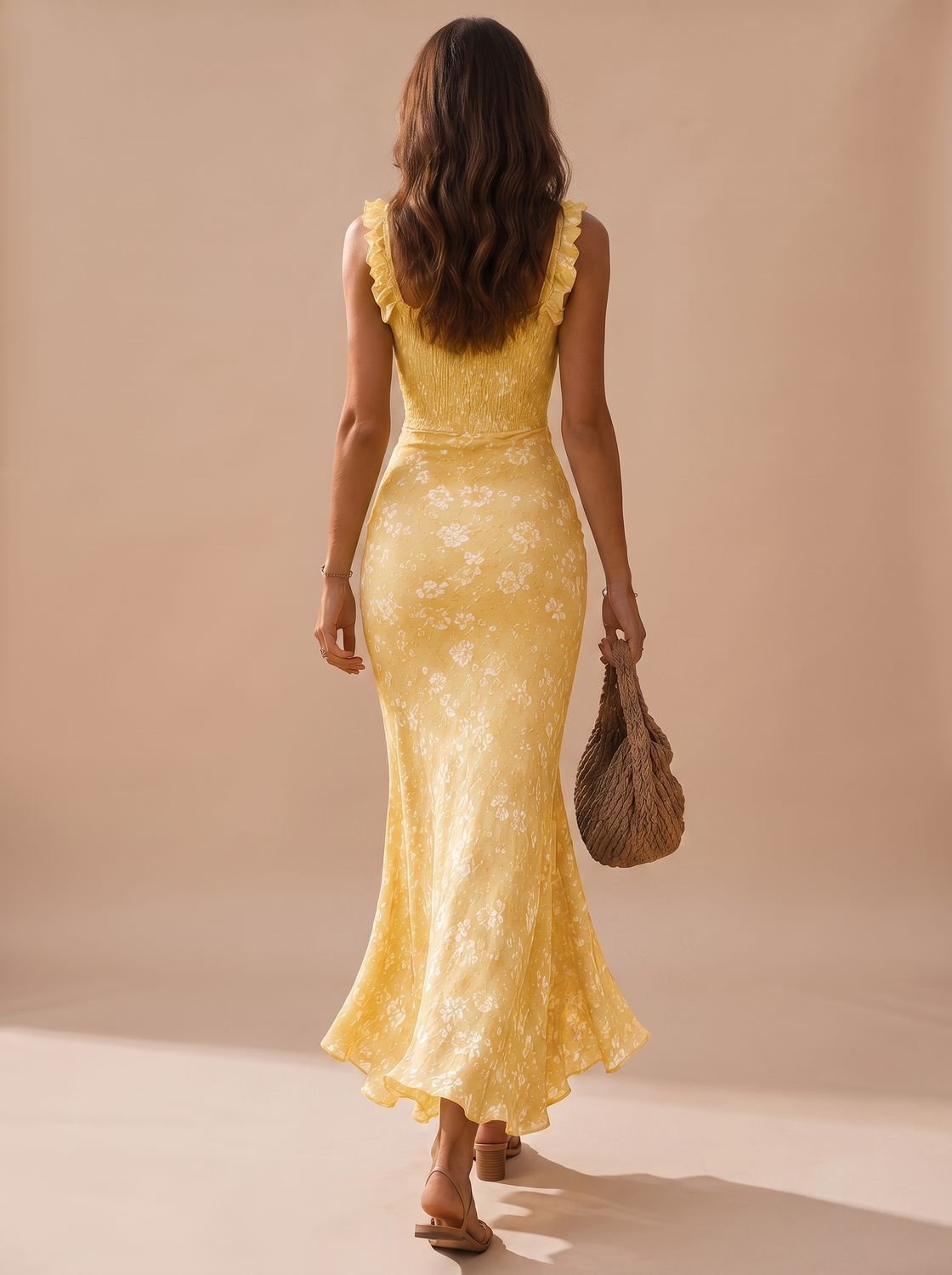 Front view of a women's floral smocked maxi dress with ruffle trim