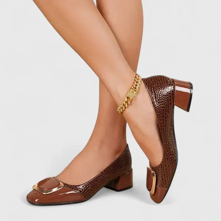 Women's loafers showing the slip-on design and block heel