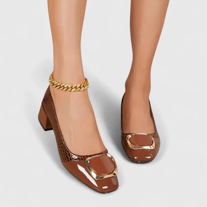 Angled view of croc-embossed women's loafers
