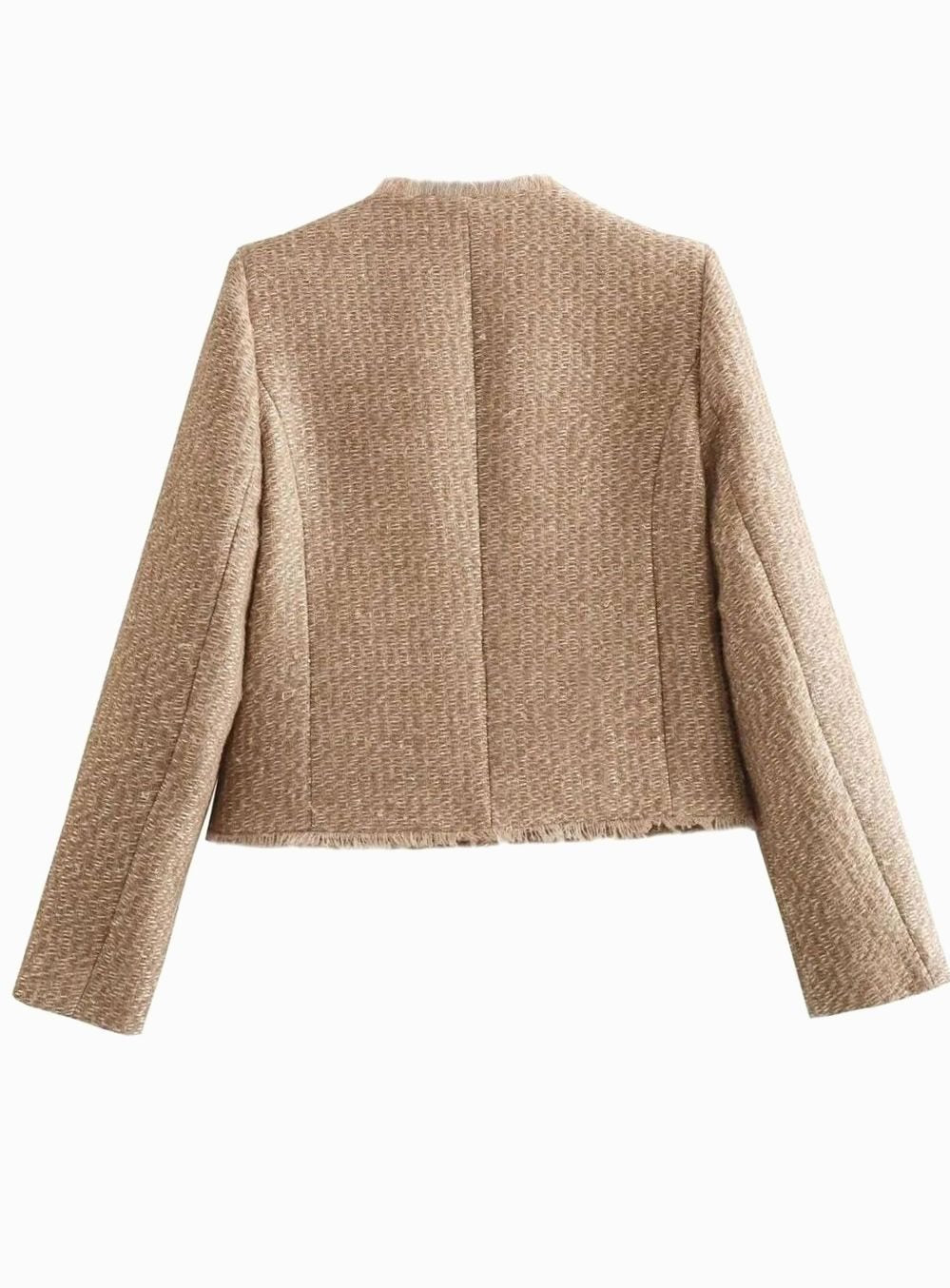 Close-up of the textured tweed fabric and button-front detail