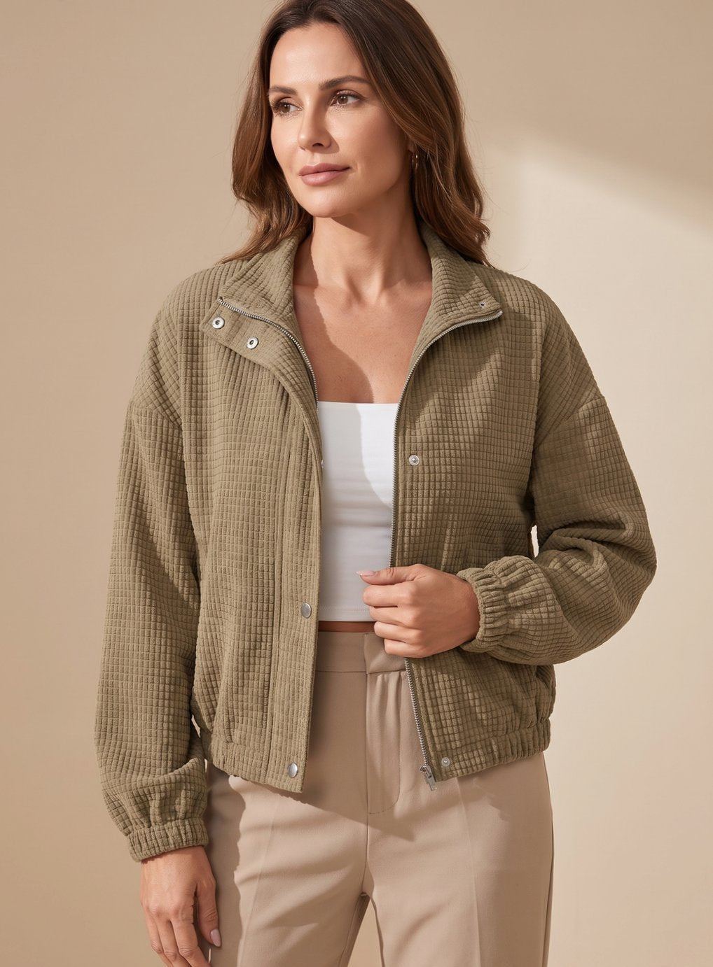 Full view of the women's waffle-knit button-up jacket on a model