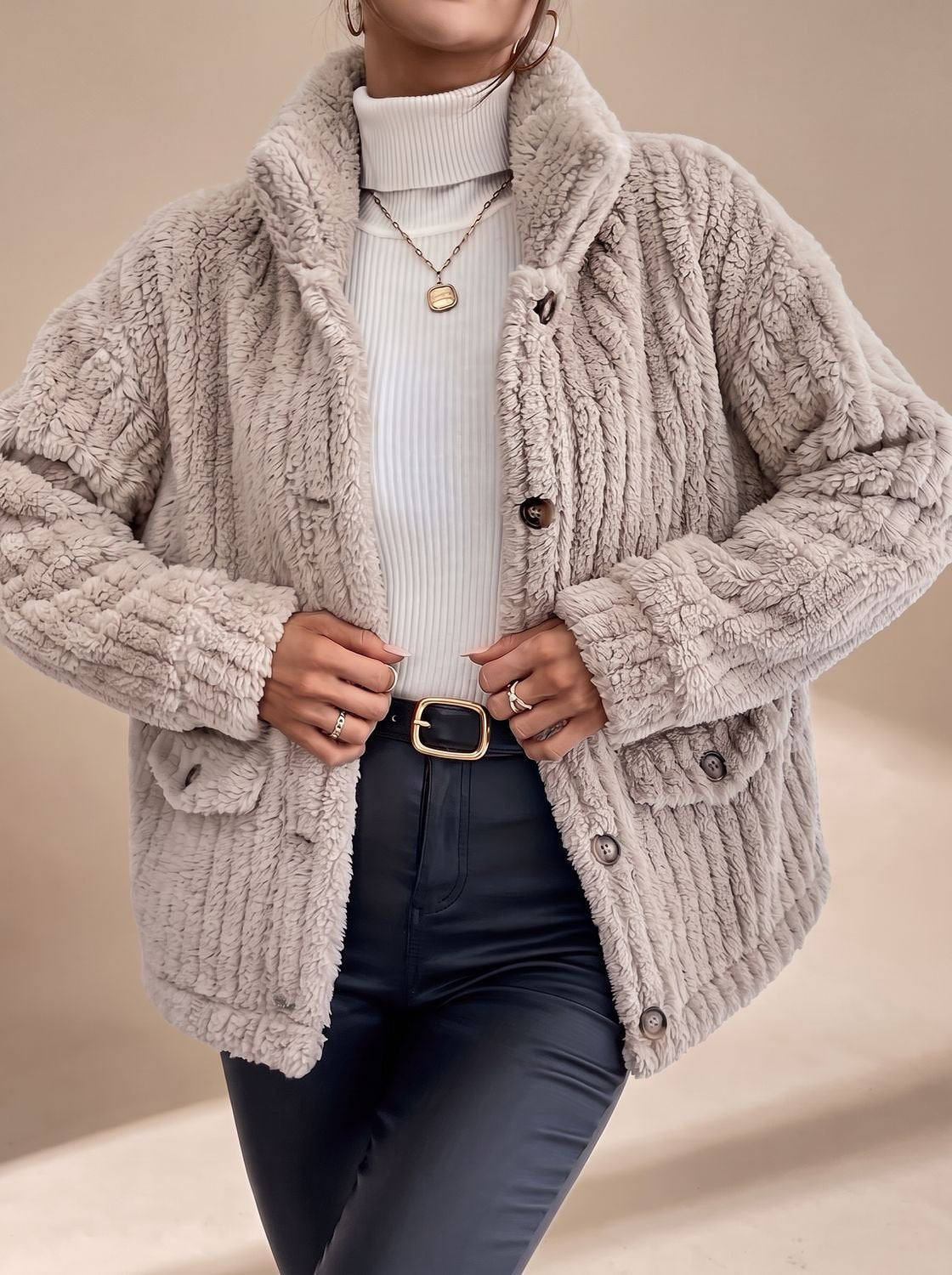 Close-up of the faux fur texture and button-front design