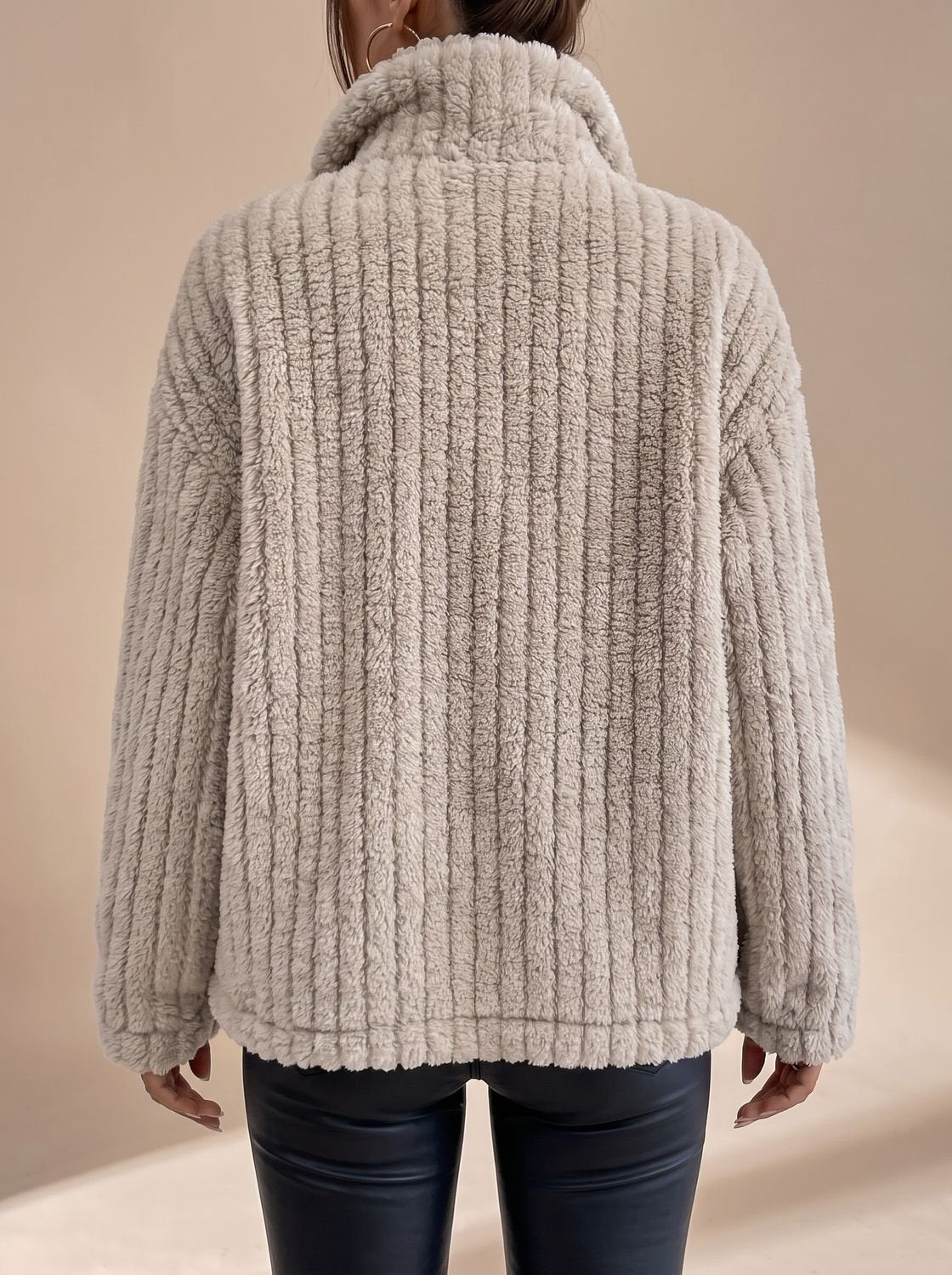 Side view of the women's teddy fleece coat with long sleeves
