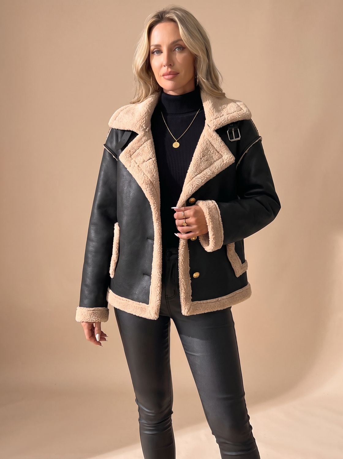 Women's jacket showing the cozy sherpa lining around the collar and front