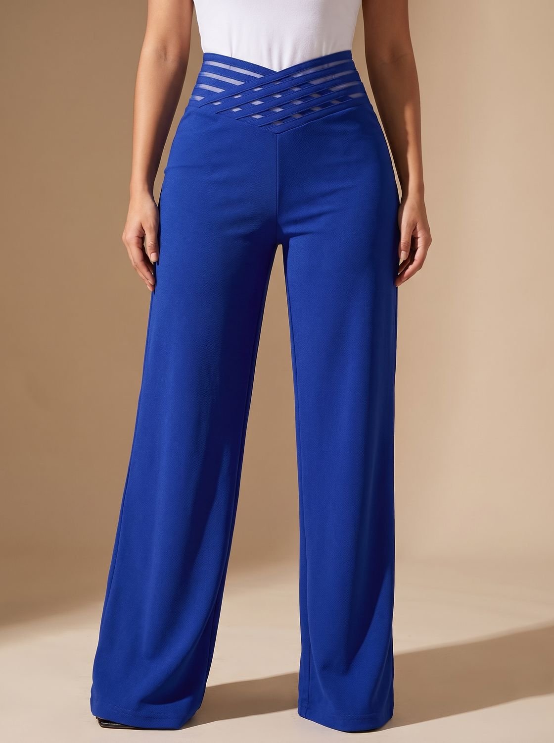 Full-length view of women's high-waist crossover-waistband pants