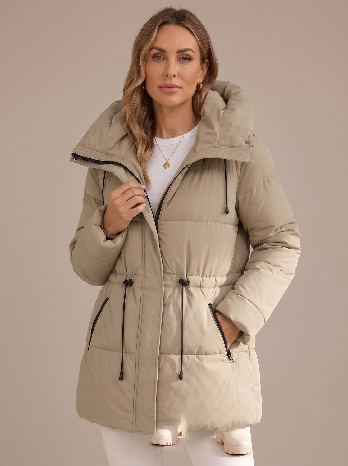Front view of a women's hooded puffer jacket with zip closure