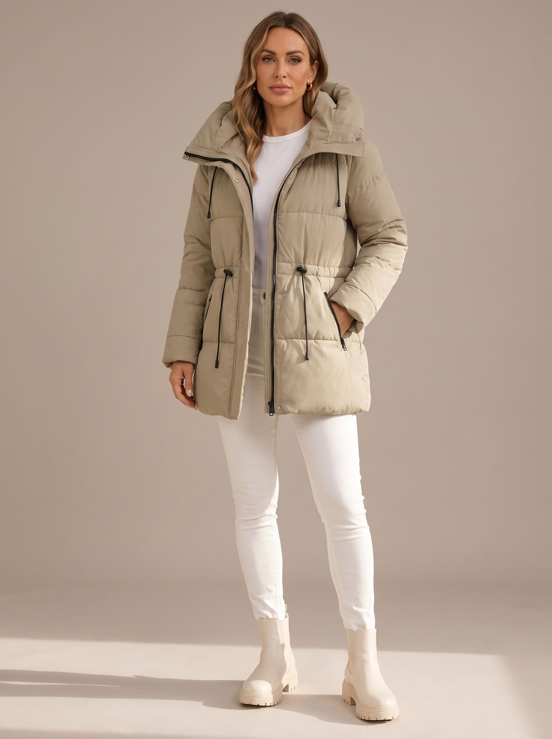 Women's hooded puffer jacket with quilted design and drawstring waist