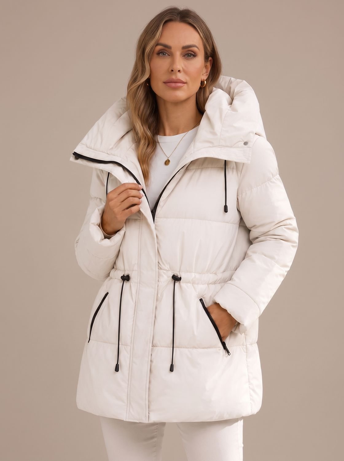 Back view of a quilted women's puffer jacket with hood
