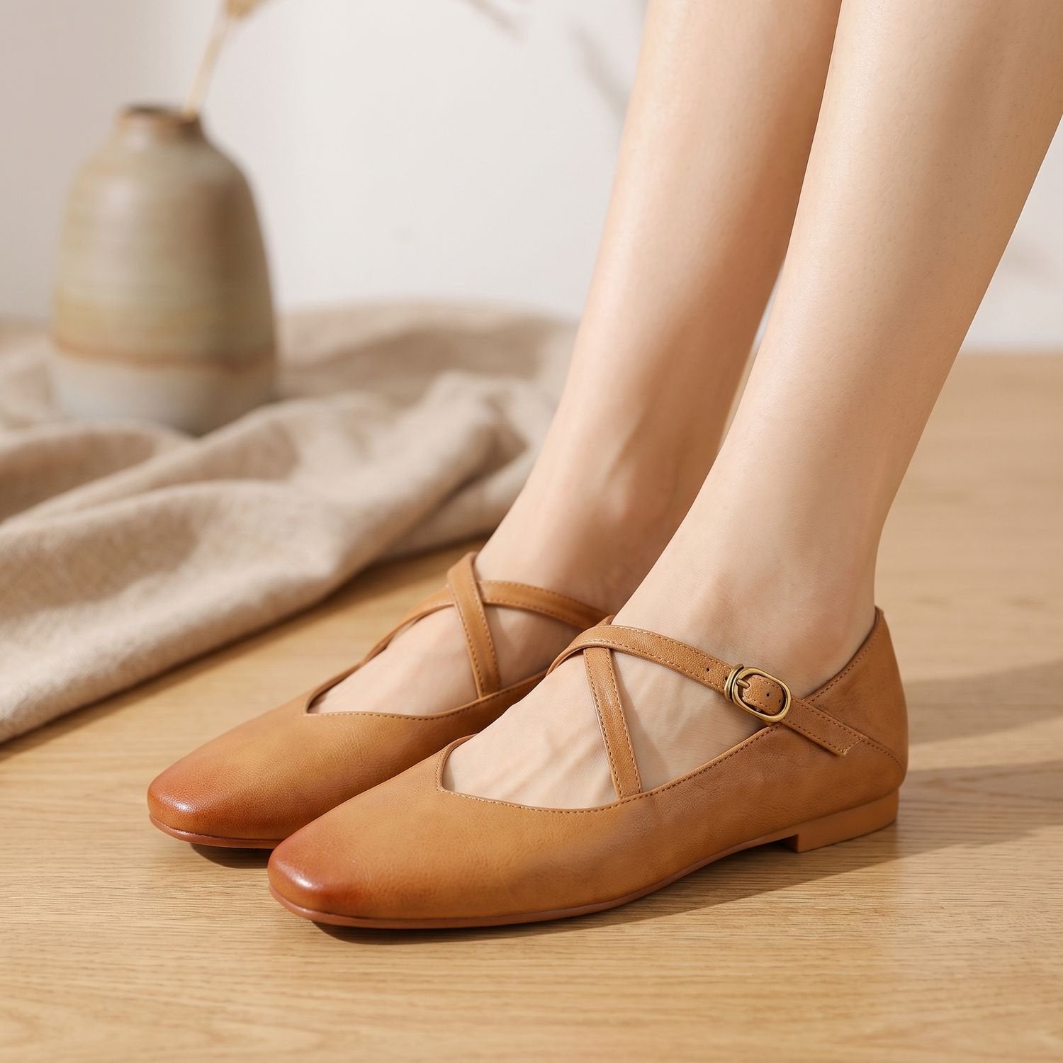 Close-up of the double straps and buckles on leather Mary Jane flats