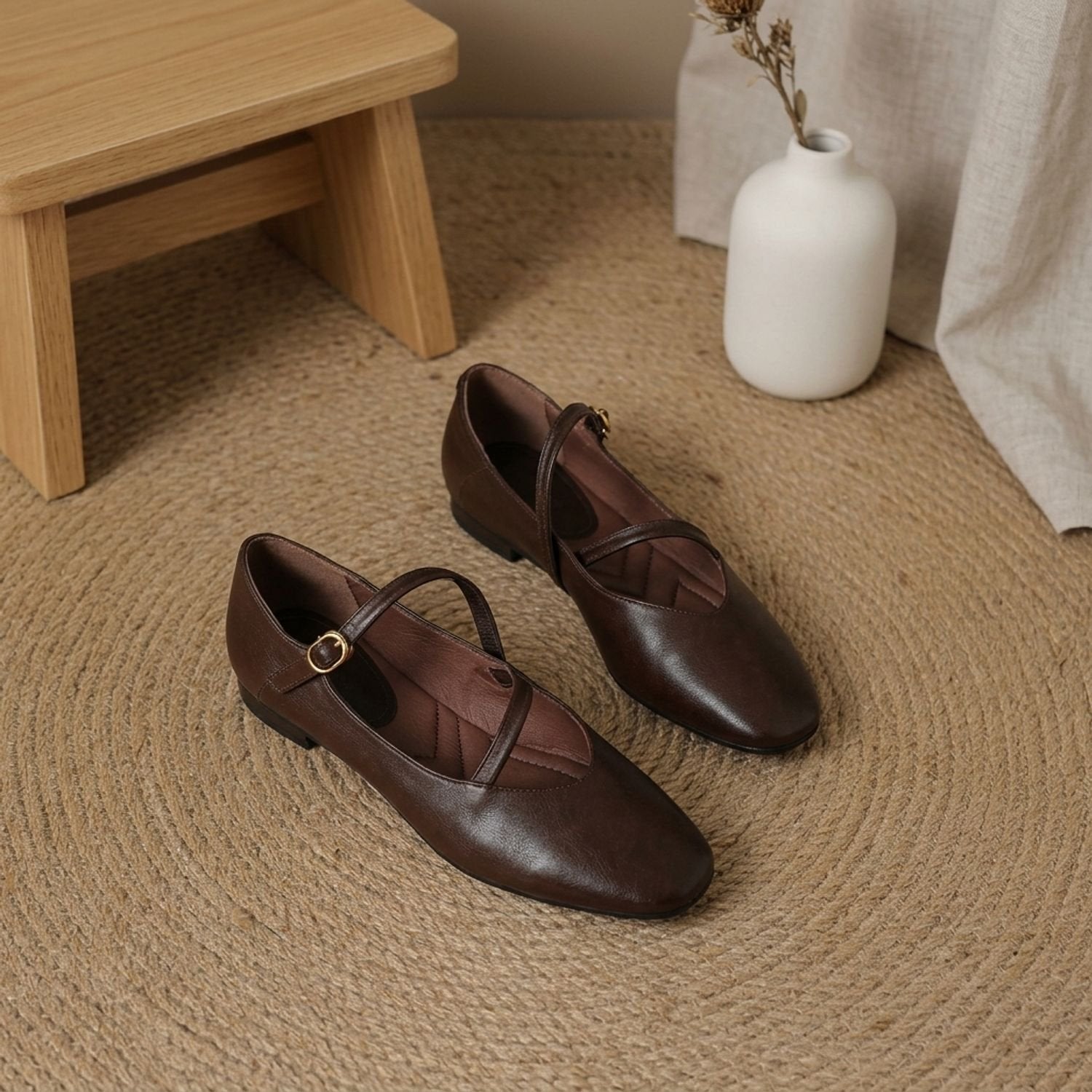 Single Mary Jane flat showing its leather upper and sole