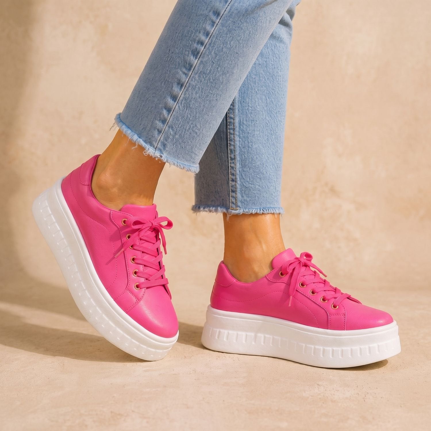 Side profile of women's tan sneakers designed for arch support