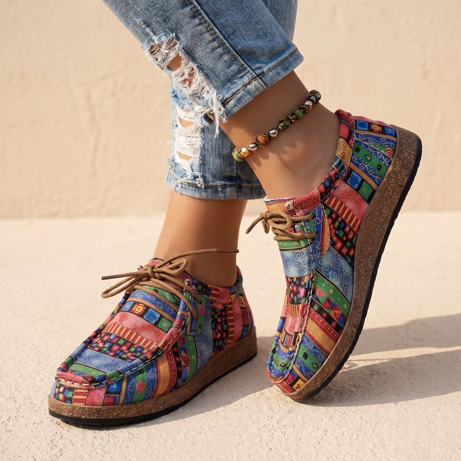 Pair of women's boho sneakers positioned together on a clean background