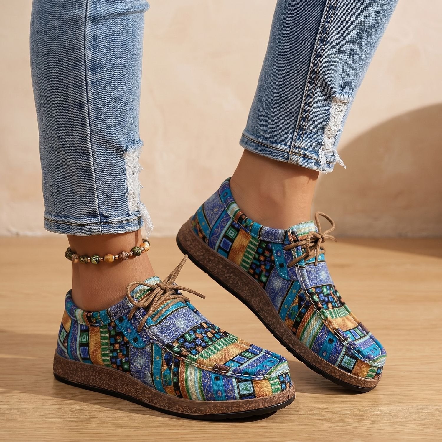 Side profile of casual women's sneakers with a textured patchwork upper