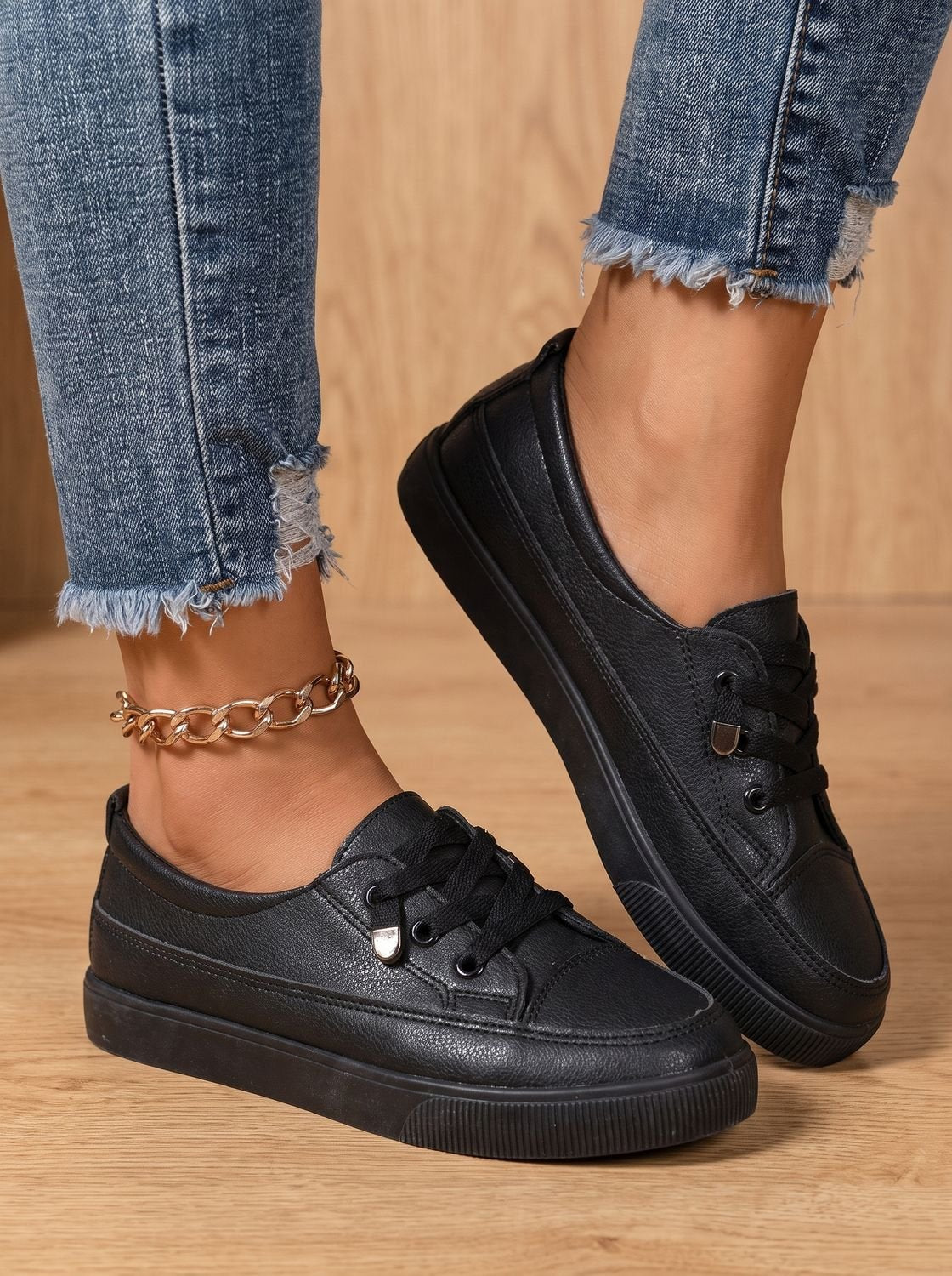 Close-up of the cushioned collar and lace-up design on a women's sneaker