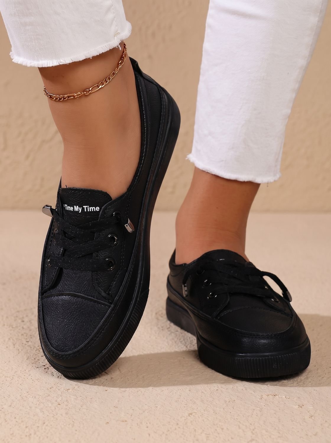 Side profile highlighting the low-top design of the women's sneakers