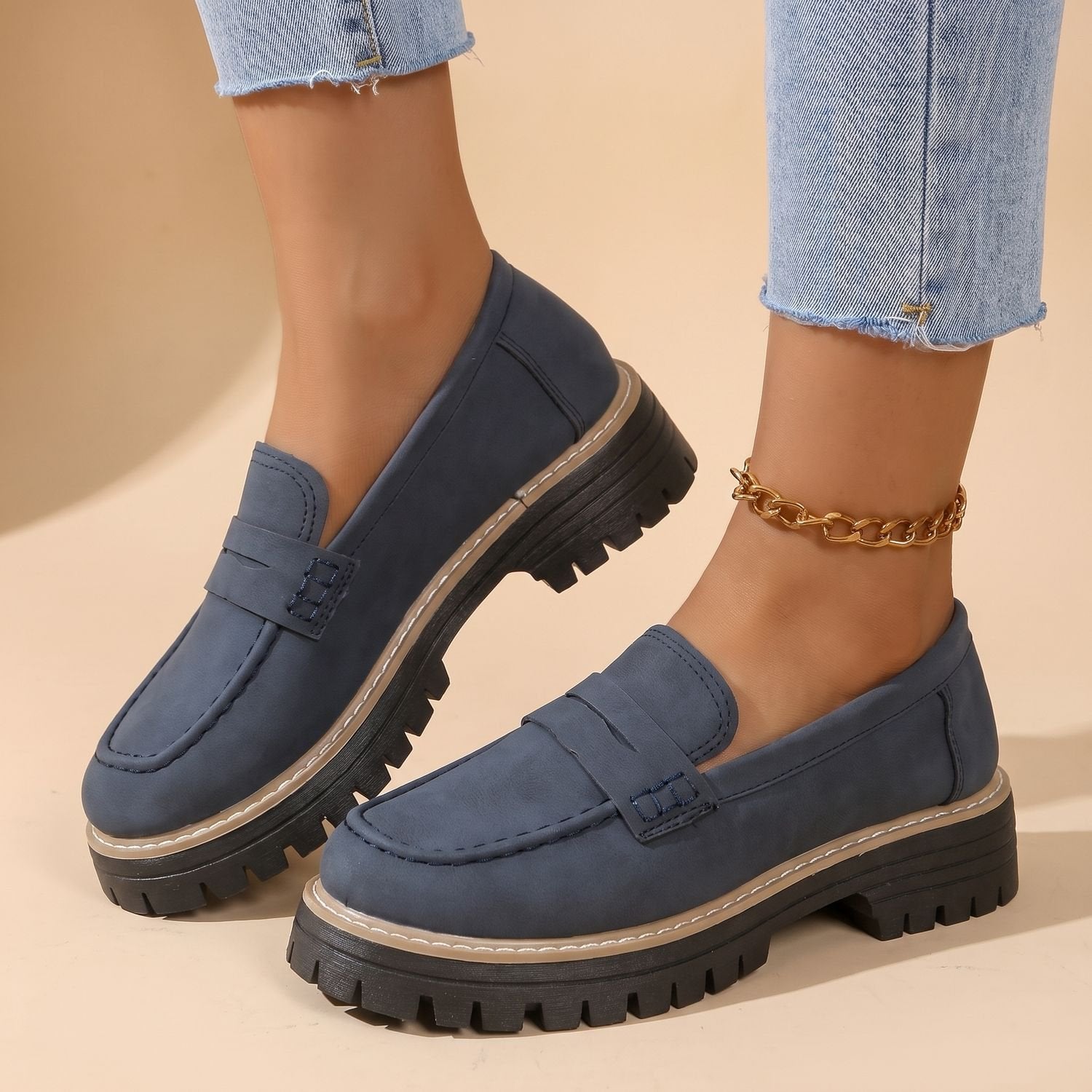 Women's cushioned platform loafers displayed as a matching pair