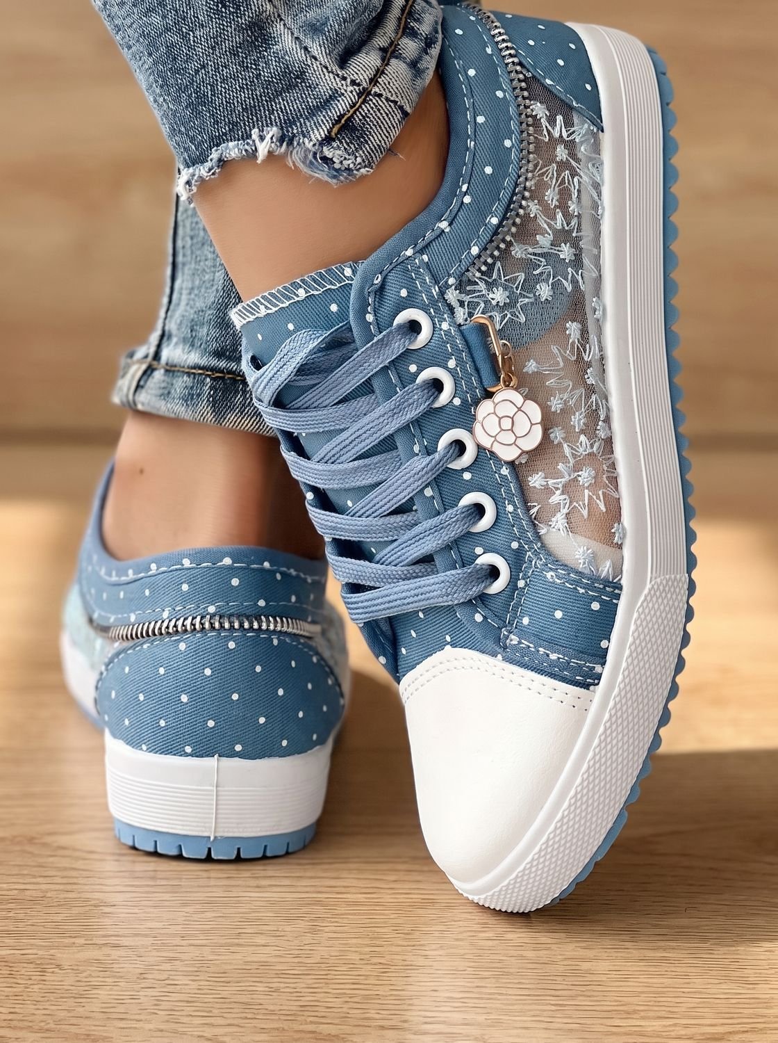 Women's lace-up floral mesh sneakers shown from the front