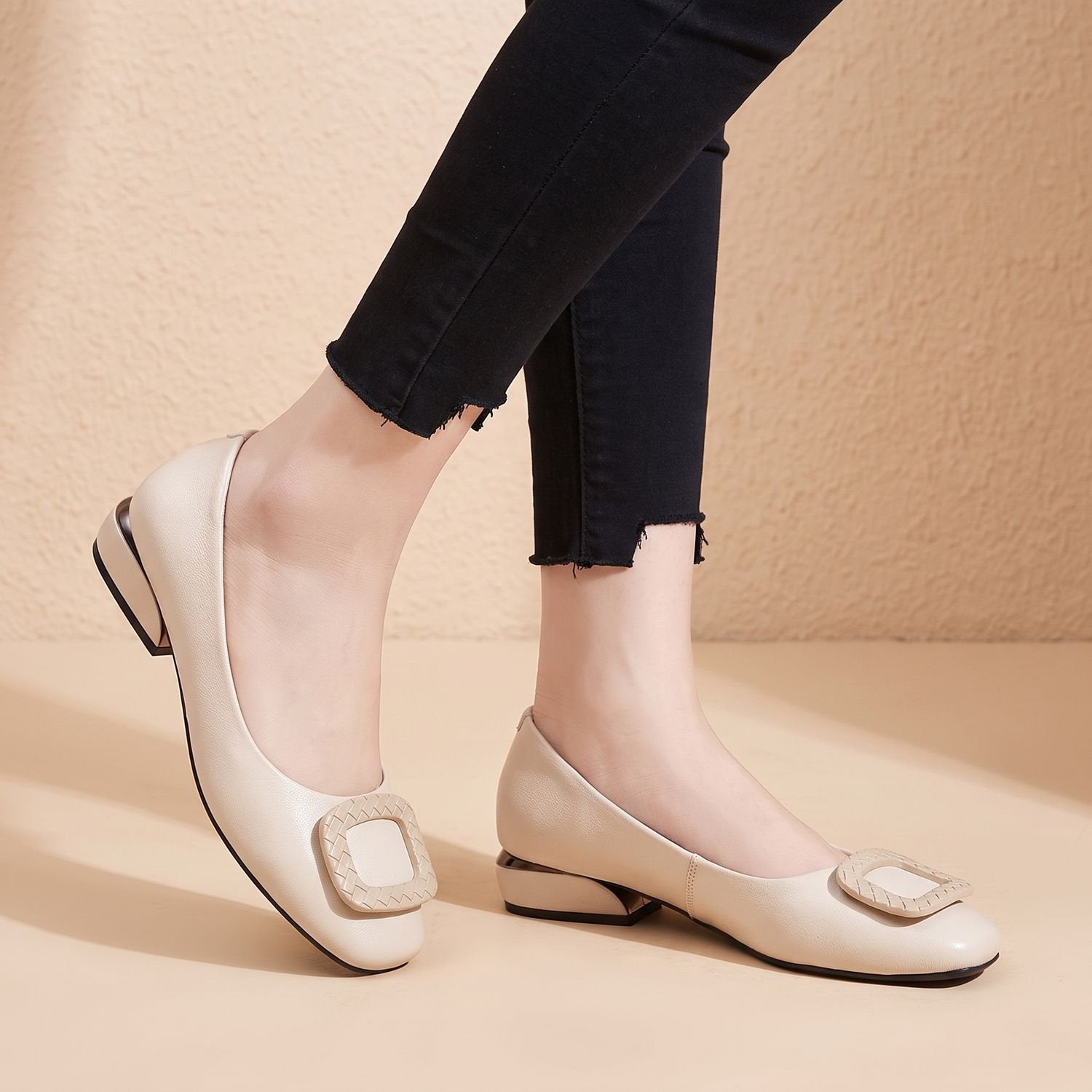 Women's leather pumps displaying the sturdy block heel