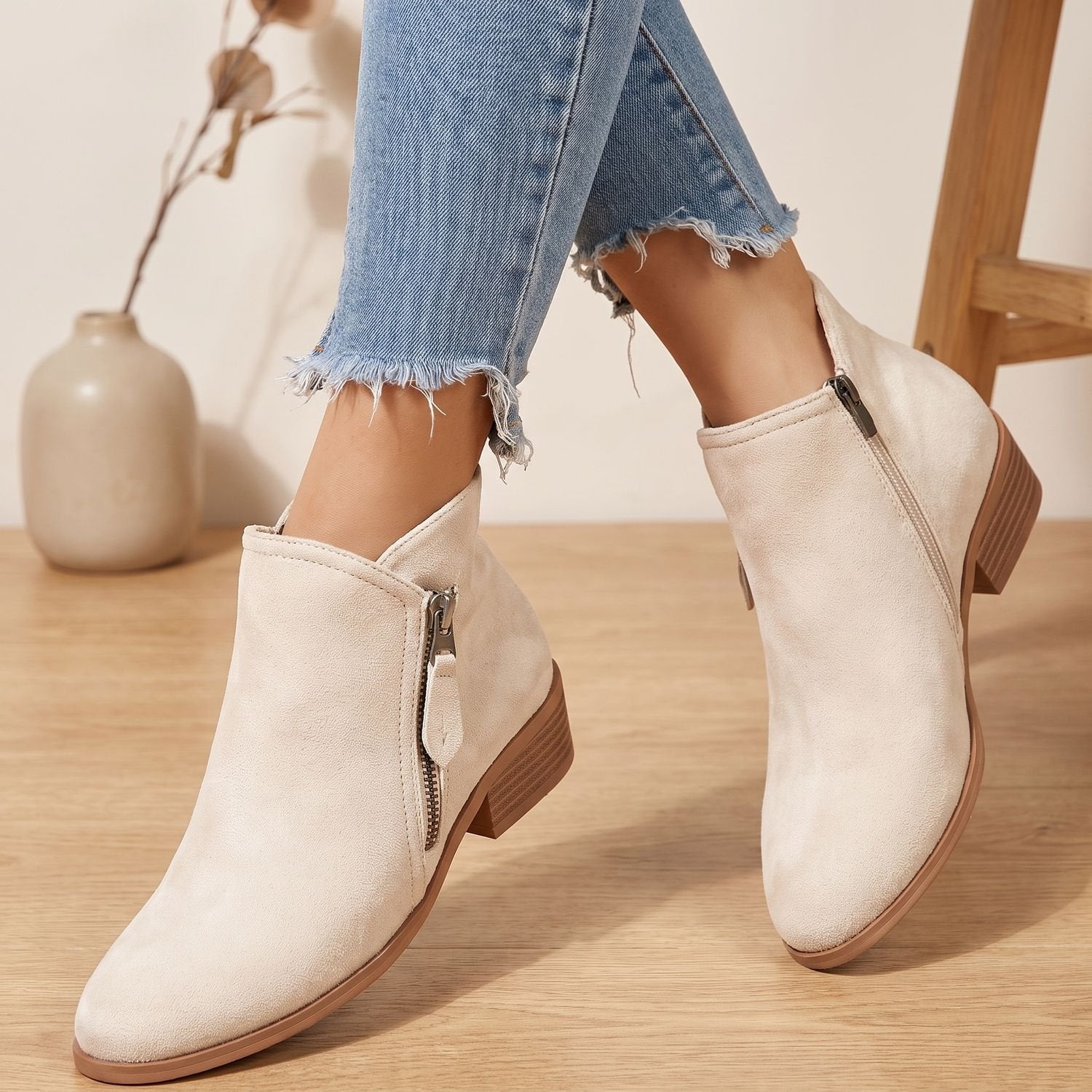 Back view of women's ankle boots highlighting the low shaft design