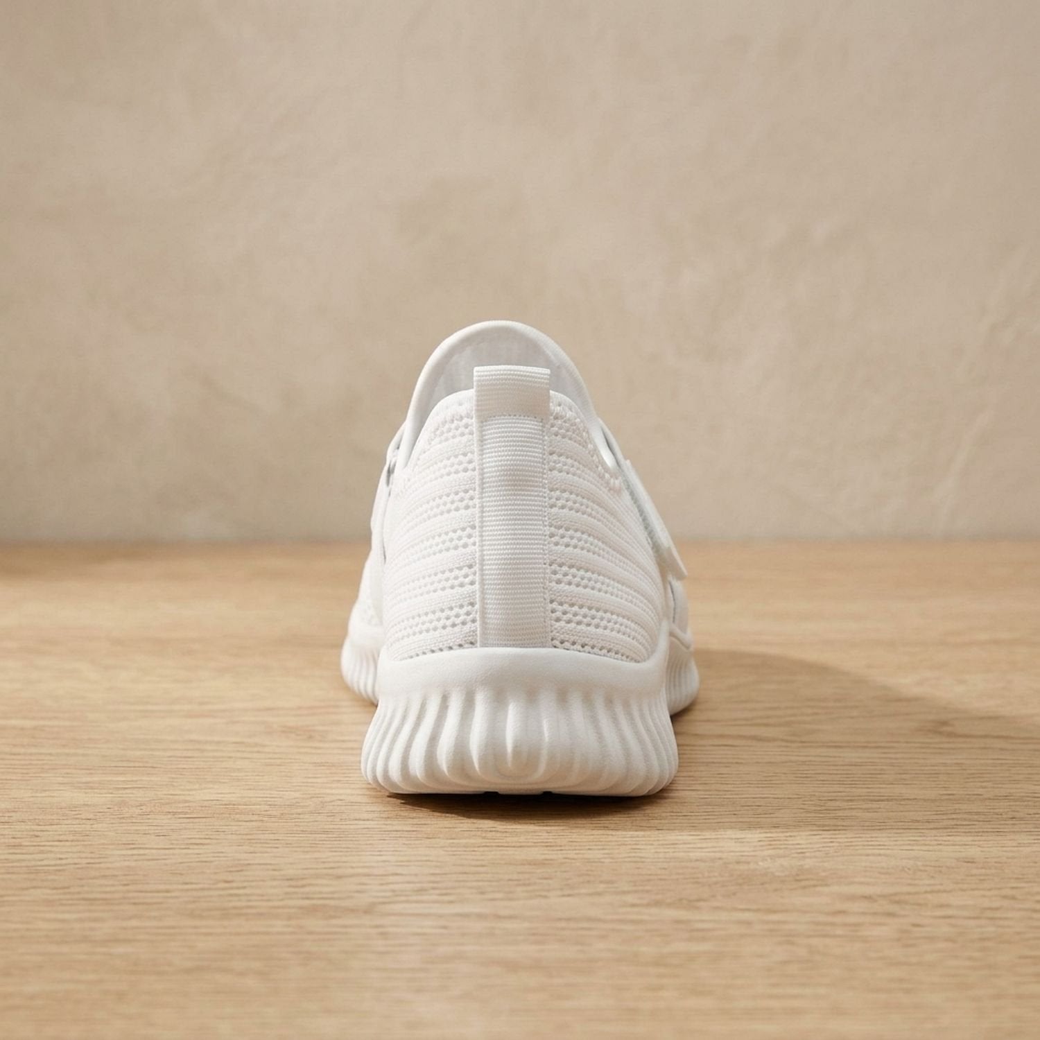 Top view of a women's slip-on sneaker with a Velcro strap