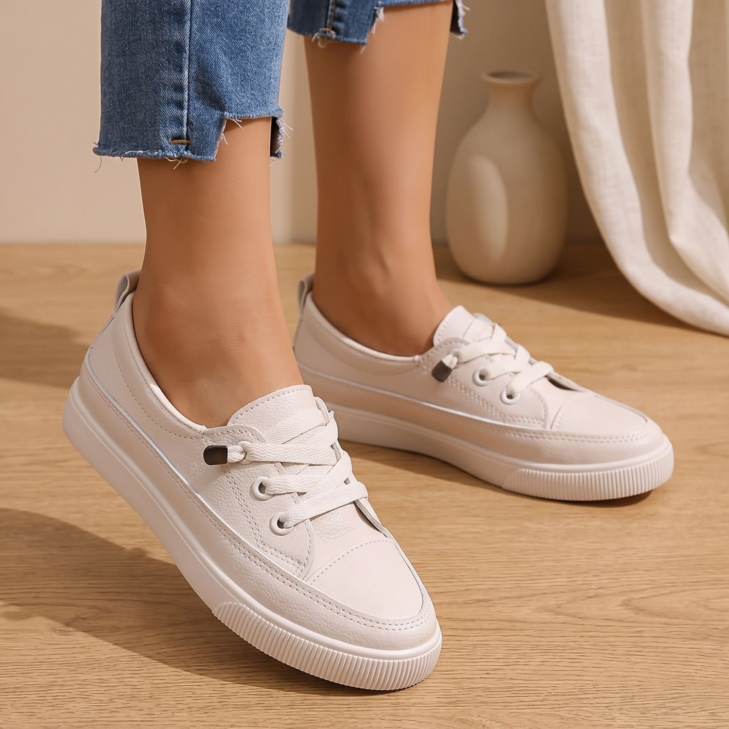 Women's lace-up sneakers with faux leather uppers shown at an angle