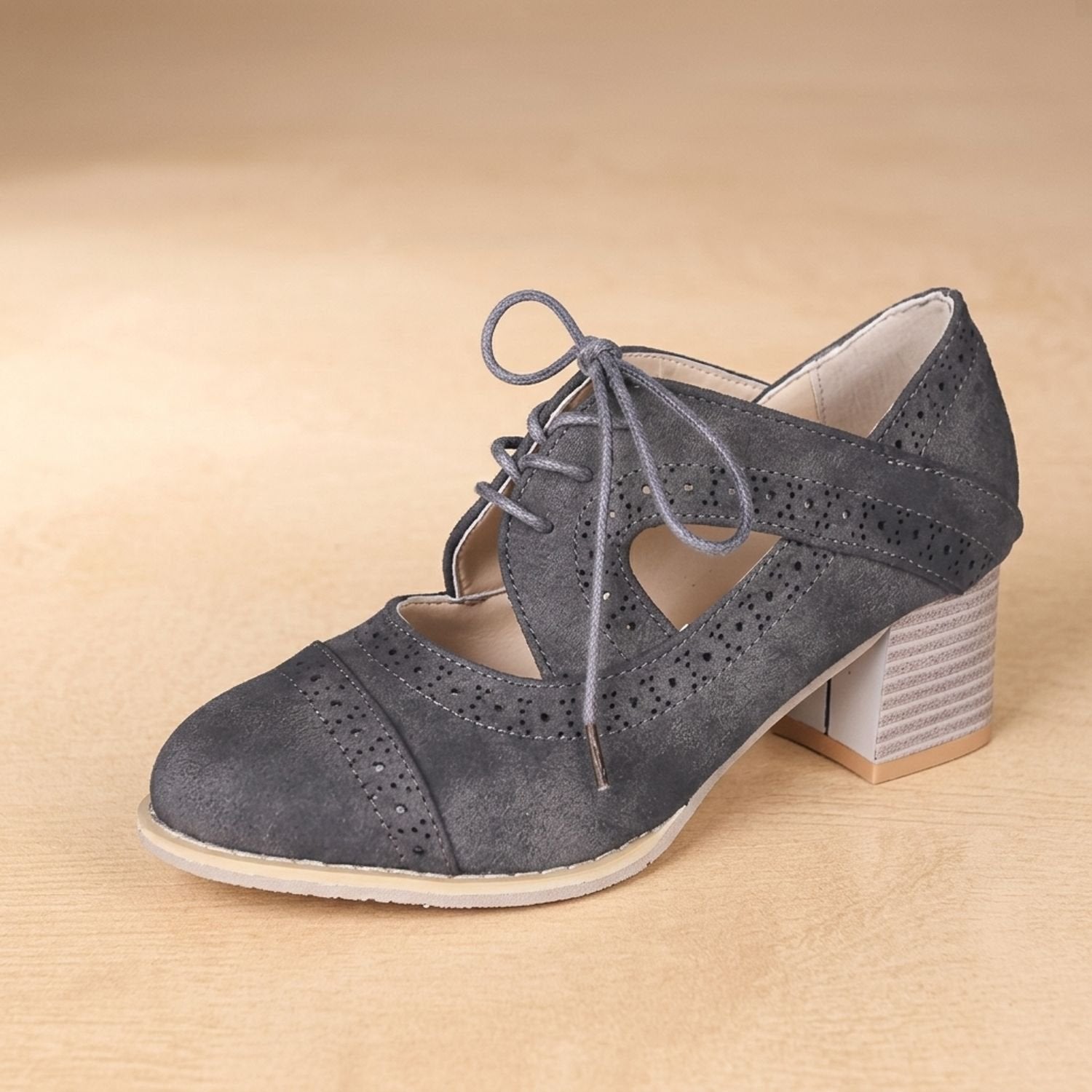 Women's vintage brogue pumps shown from above with decorative lacing
