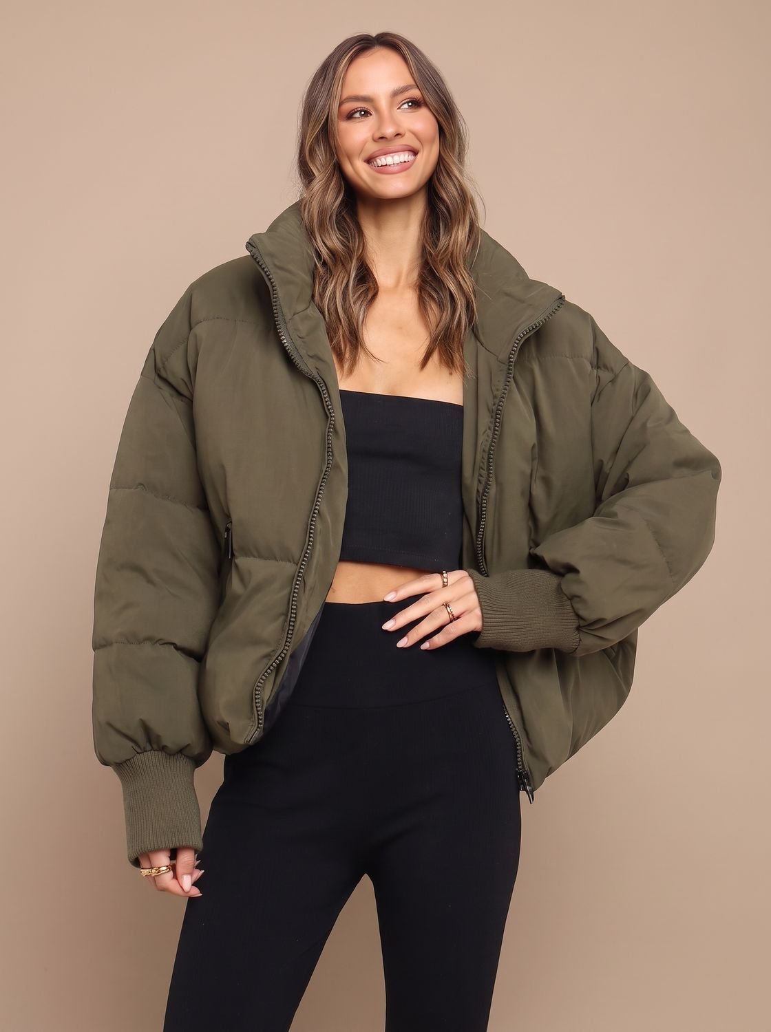 Women's puffer jacket with ribbed cuffs shown on the sleeves