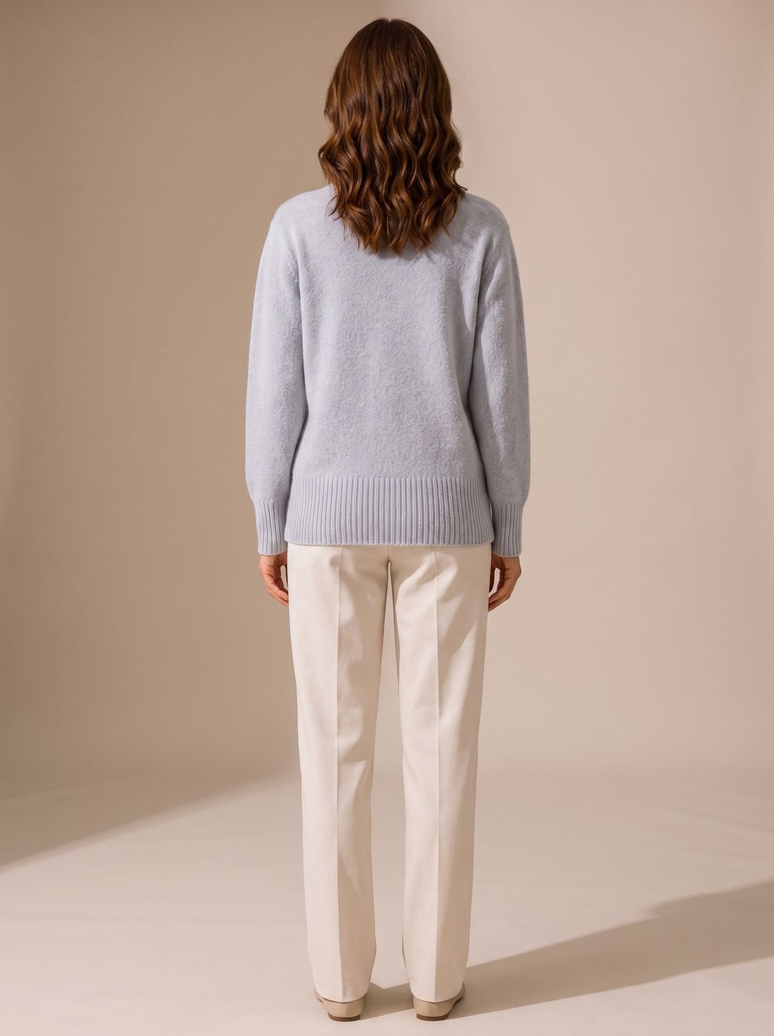 Front view of a women's knit cardigan with a V-neckline