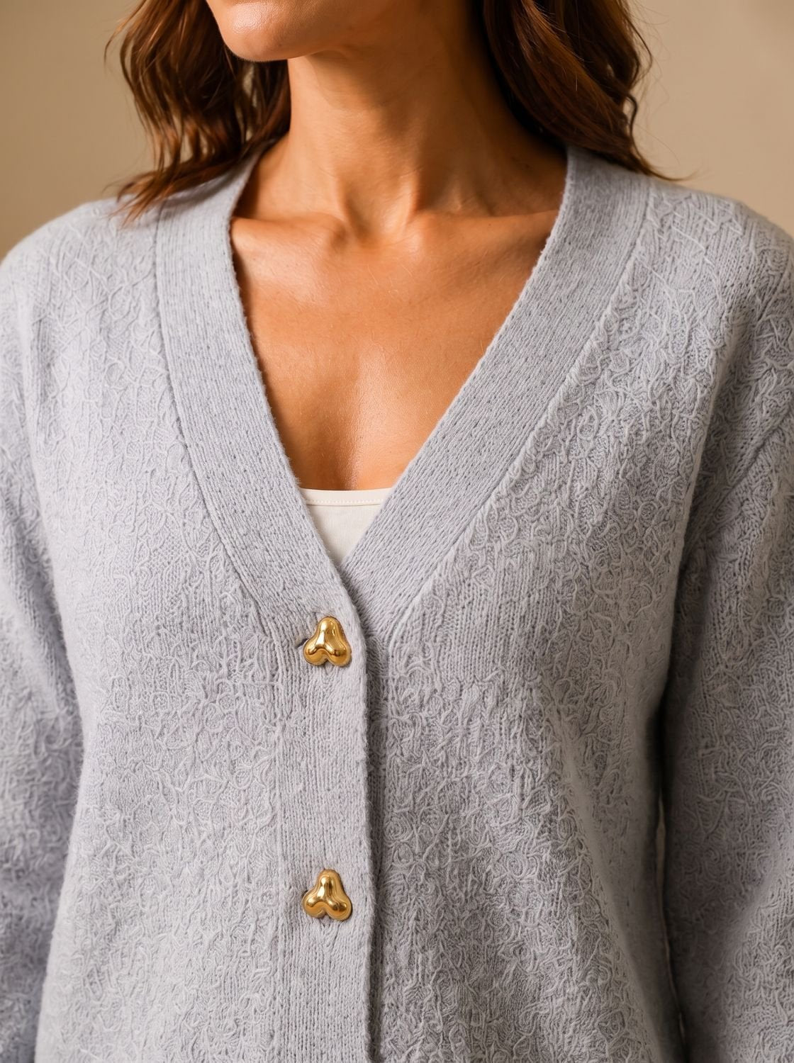 Close-up of heart-shaped buttons on a women's cardigan