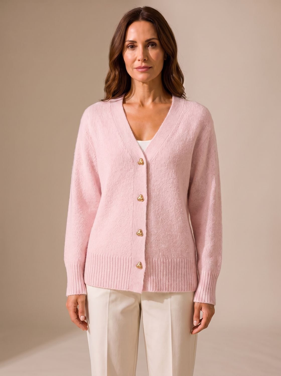 Women's cardigan showing its relaxed fit and button-front design