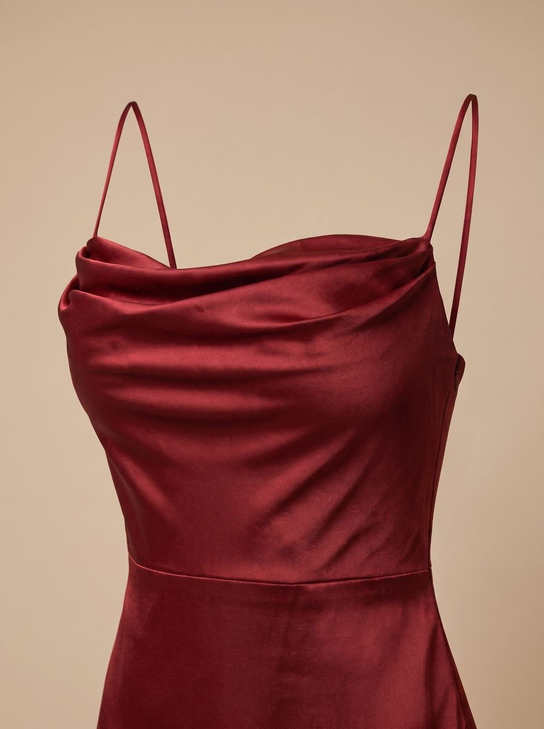 Satin maxi dress showcasing its draped cowl neckline