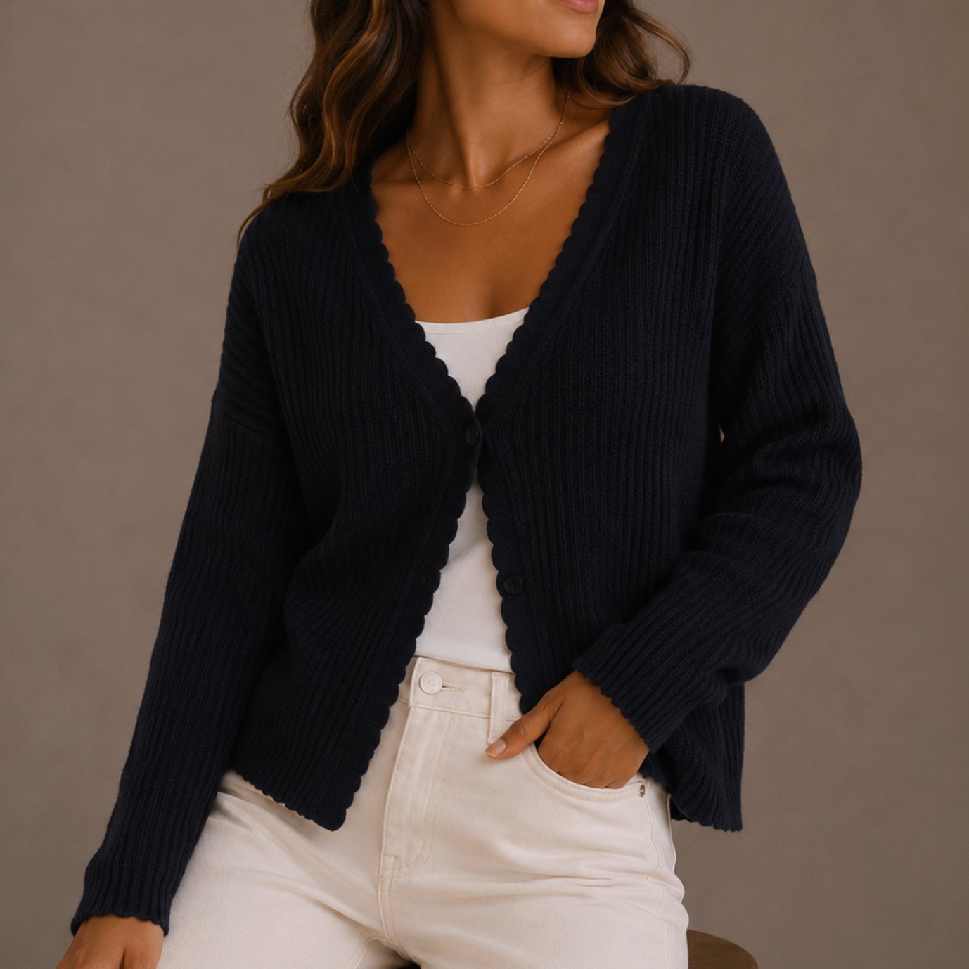 Detail view of the cardigan's soft ribbed knit texture