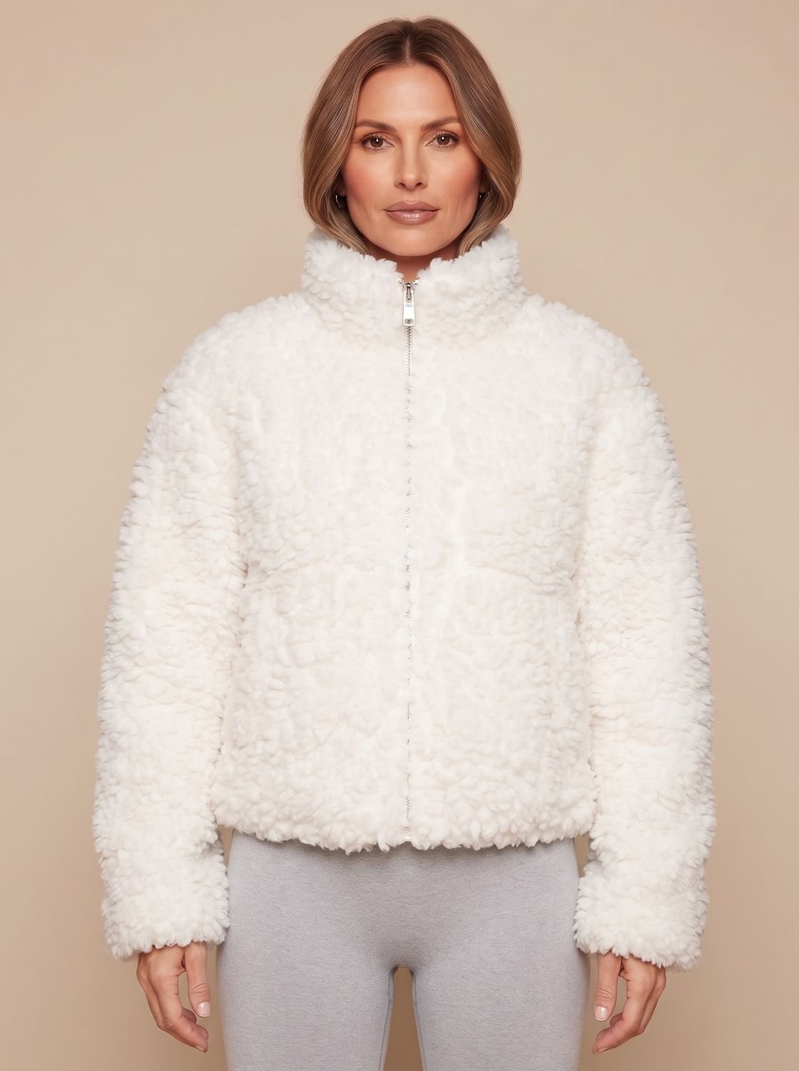 Close-up of the soft sherpa fleece texture on a women's zip-up jacket